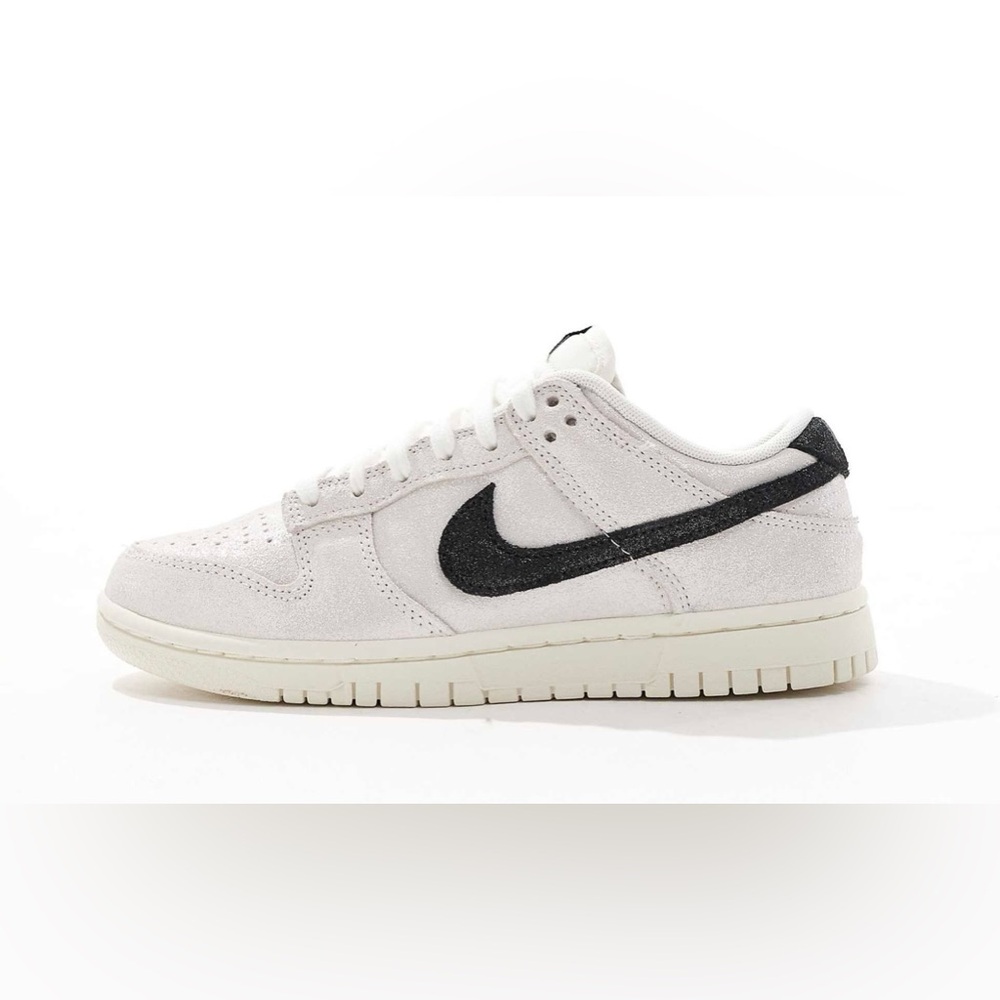 Nike Dunk Low glitter sneakers in white and black.
